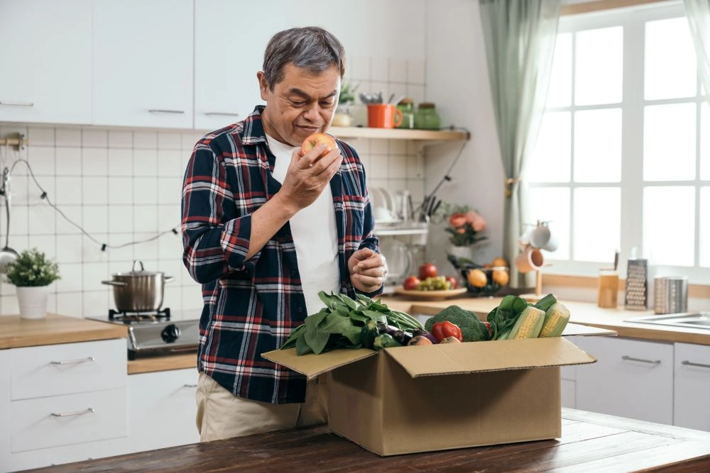 senior man with vegetables